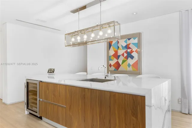 a kitchen with a dining table and chairs in it