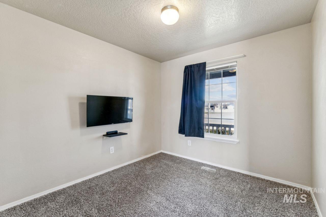 5410 Barkley Way Caldwell, ID 83607 - Photo 20 of 50 Unfurnished room with a textured ceiling and carpet