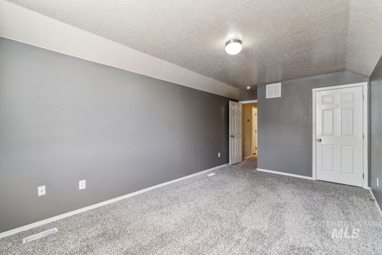 5410 Barkley Way Caldwell, ID 83607 - Photo 25 of 50 Unfurnished bedroom with baseboards and carpet floors