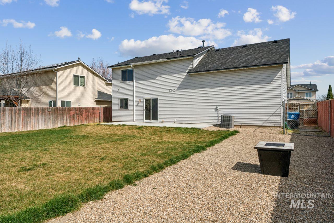 5410 Barkley Way Caldwell, ID 83607 - Photo 41 of 50 Back of property featuring a fenced backyard, a gate, a patio, and a shingled roof