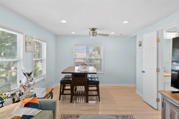 a bedroom with a bed and ceiling fan