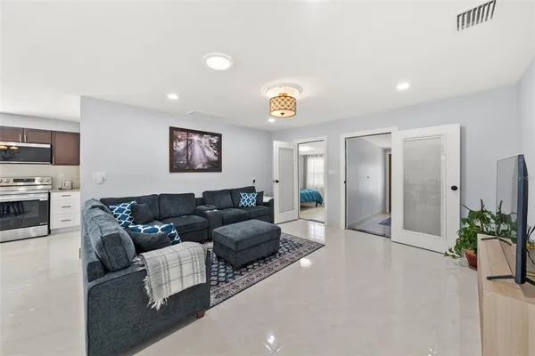 a living room with furniture and a flat screen tv