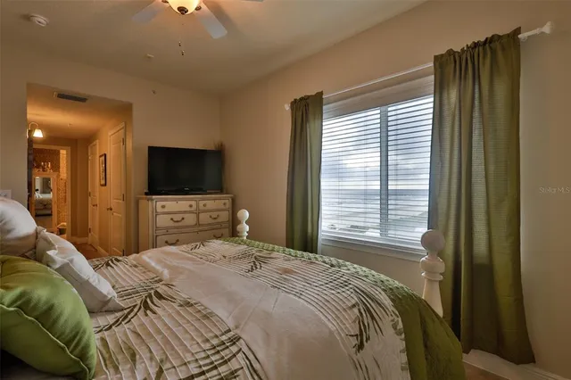 a bedroom with a bed and window