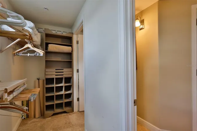 a bathroom with a granite countertop sink mirror vanity and toilet