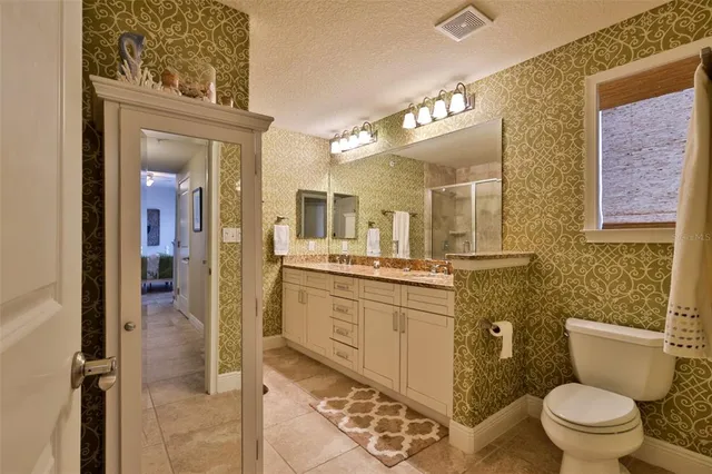 a bathroom with a shower and a sink