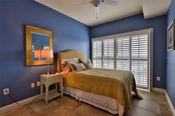 a bedroom with a bed and dresser