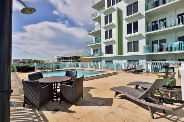 a terrace of a house with outdoor seating