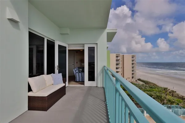 a view of a swimming pool with an outdoor seating