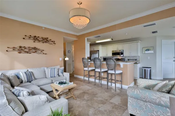 a kitchen with stainless steel appliances granite countertop a sink refrigerator and microwave