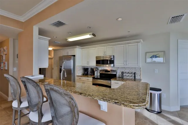 a bedroom with a bed next to a large window with swimming pool