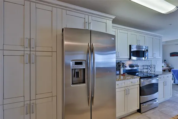 a view of a livingroom with furniture and windows