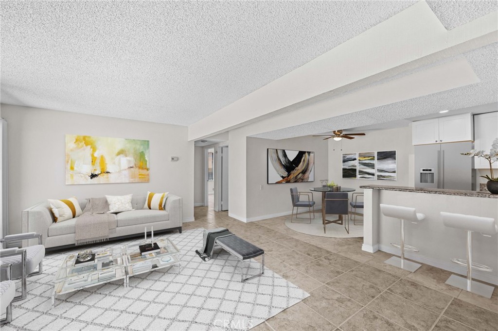1440 West Edgehill Road, Unit 23 San Bernardino, CA 92405 - Photo 1 of 1 a living room with furniture and a table