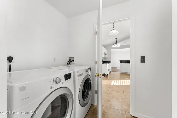 a spacious bathroom with a double vanity sink a mirror and shower