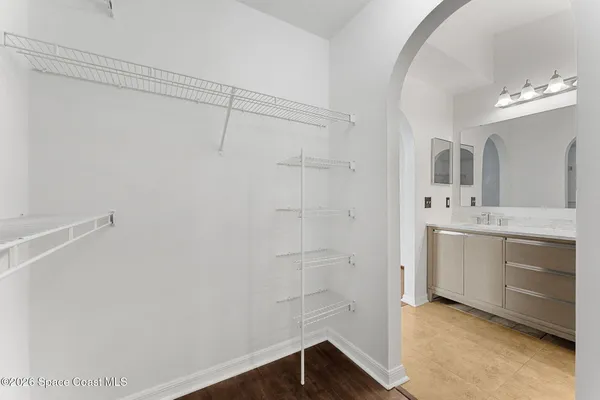 a view of a livingroom with an empty space and a window