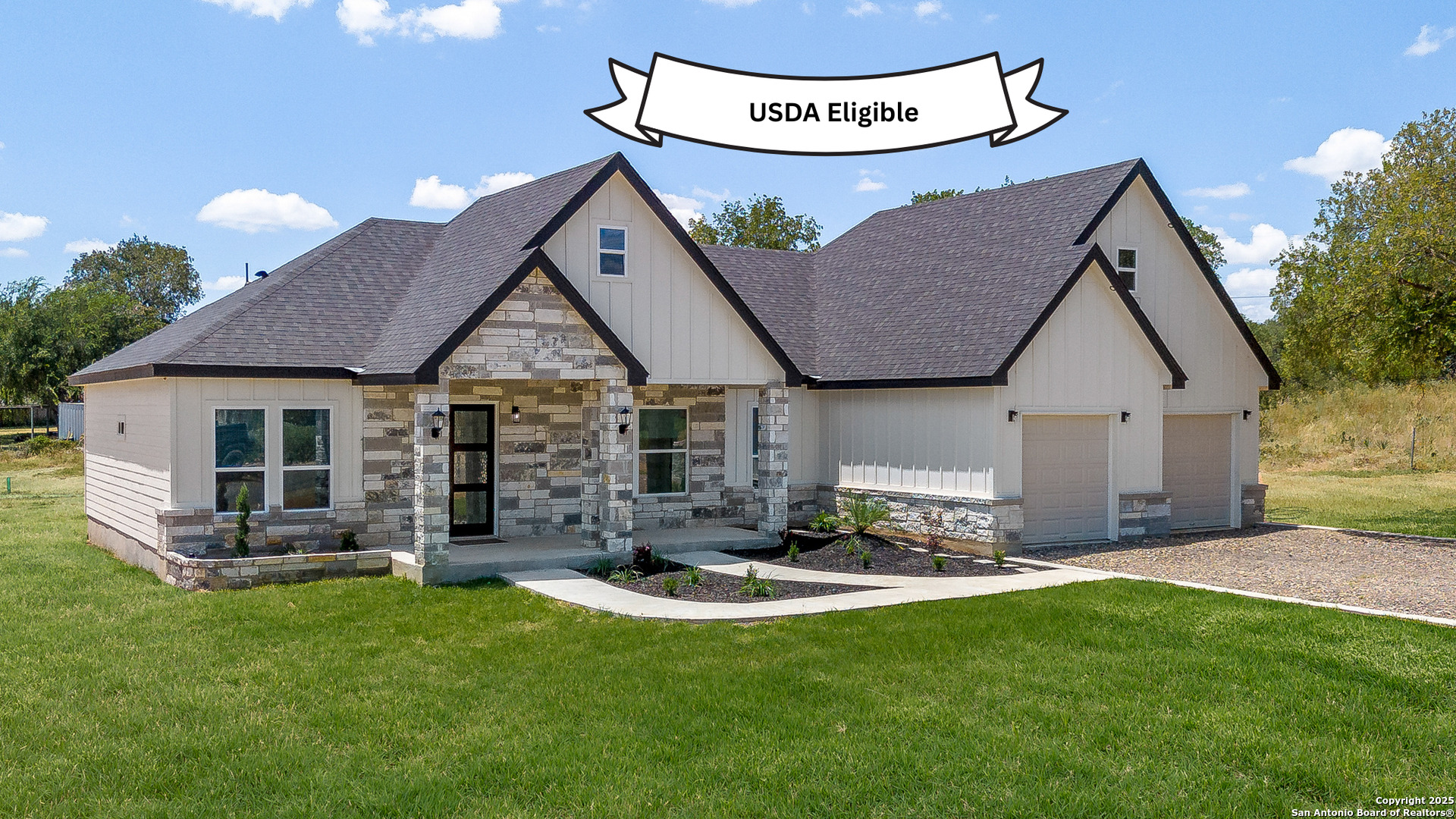 a view of a house with table and chairs in the patio
