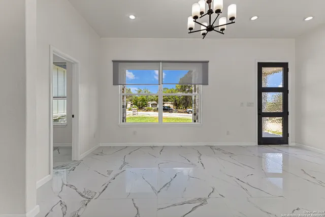 a large kitchen with stainless steel appliances a large counter top and oven