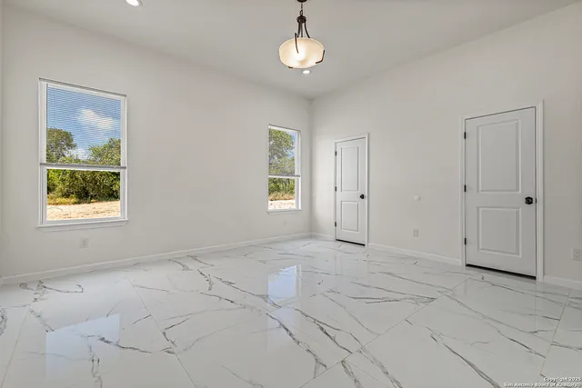 an empty room with chandelier