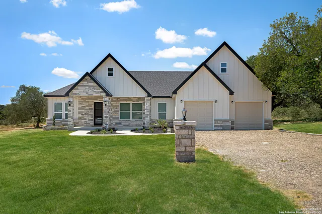 a front view of a house with swimming pool having outdoor seating