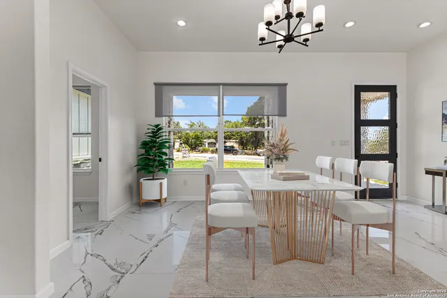 a view of a dining room with furniture window and outside view