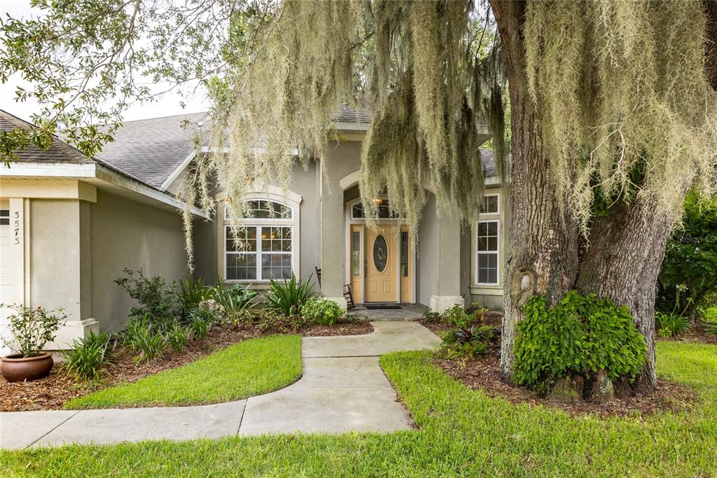 3573 Southwest 72nd Way Gainesville, FL 32608 - Photo 5 of 41 Beautiful, mature oak in front yard leading up to home.