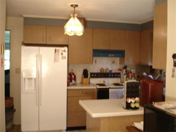 26 Fomer Road Southampton, MA 01073 - Photo 12 of 29 a kitchen with a refrigerator and a stove