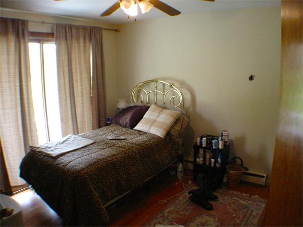 26 Fomer Road Southampton, MA 01073 - Photo 21 of 29 a bed sitting in a bedroom next to a window