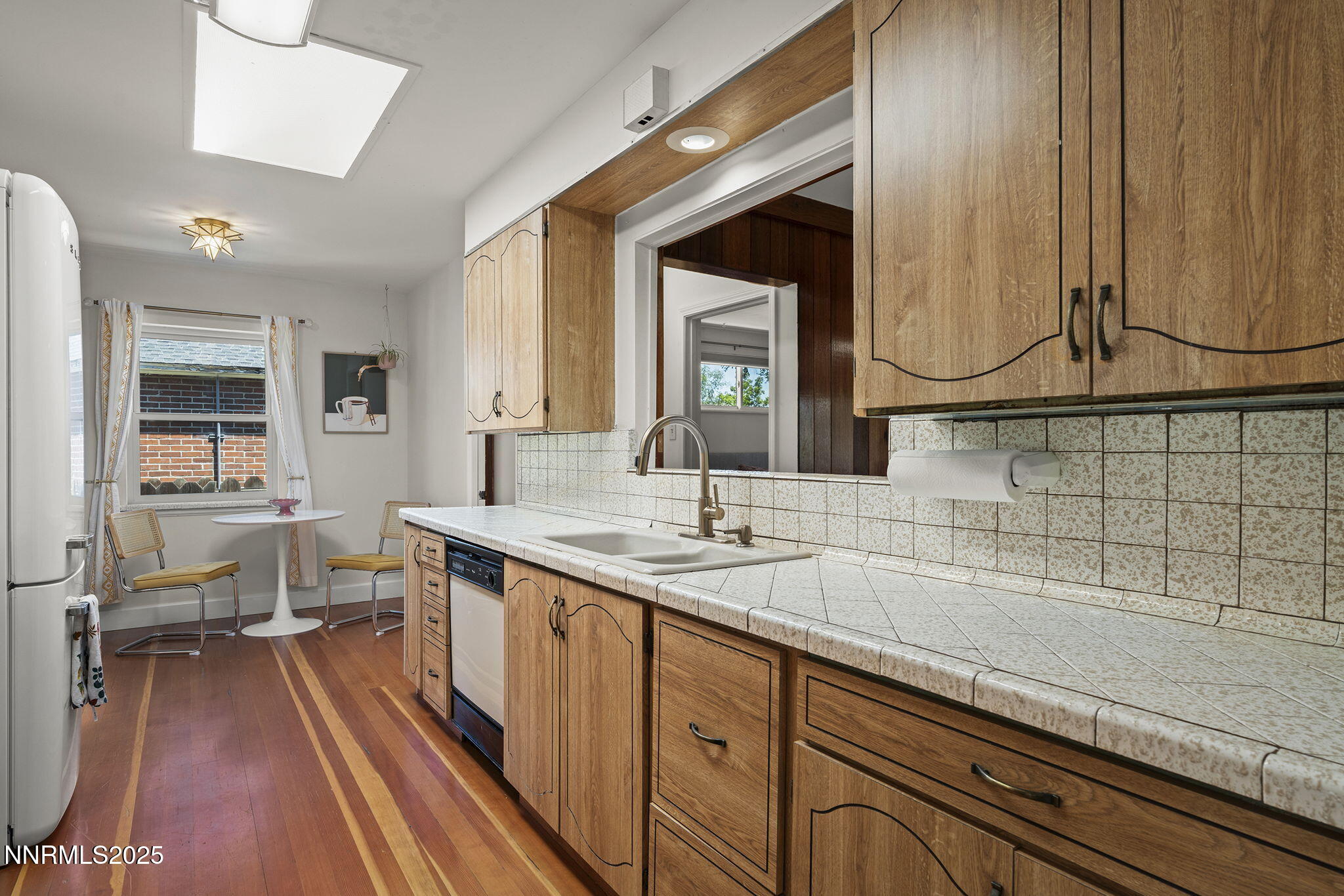 2330 Sunrise Drive Reno, NV 89509 - Photo 23 of 48 a spacious bathroom with a double vanity sink a mirror and a bathtub