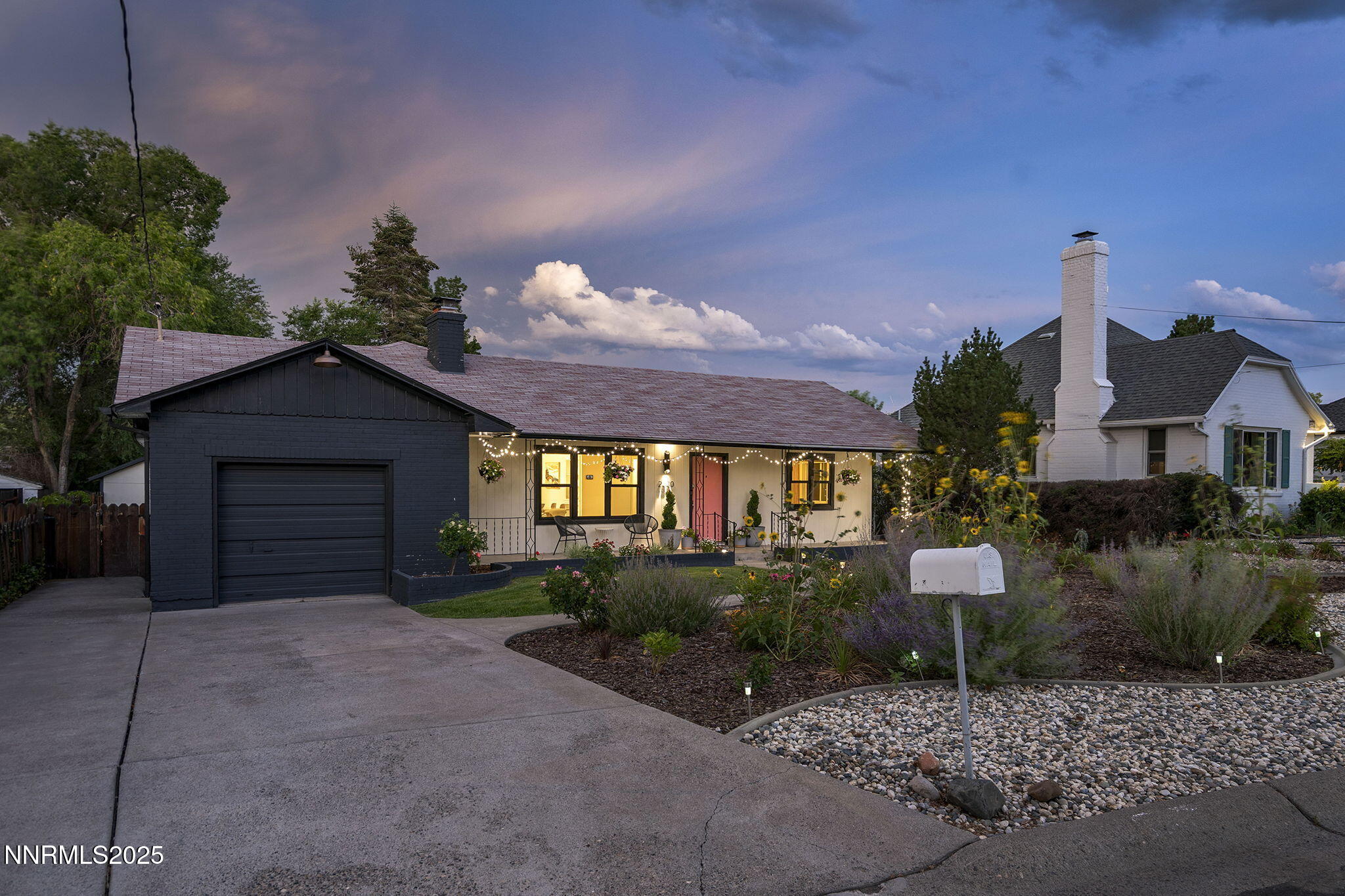 2330 Sunrise Drive Reno, NV 89509 - Photo 3 of 48 a front view of a house with a yard and garage