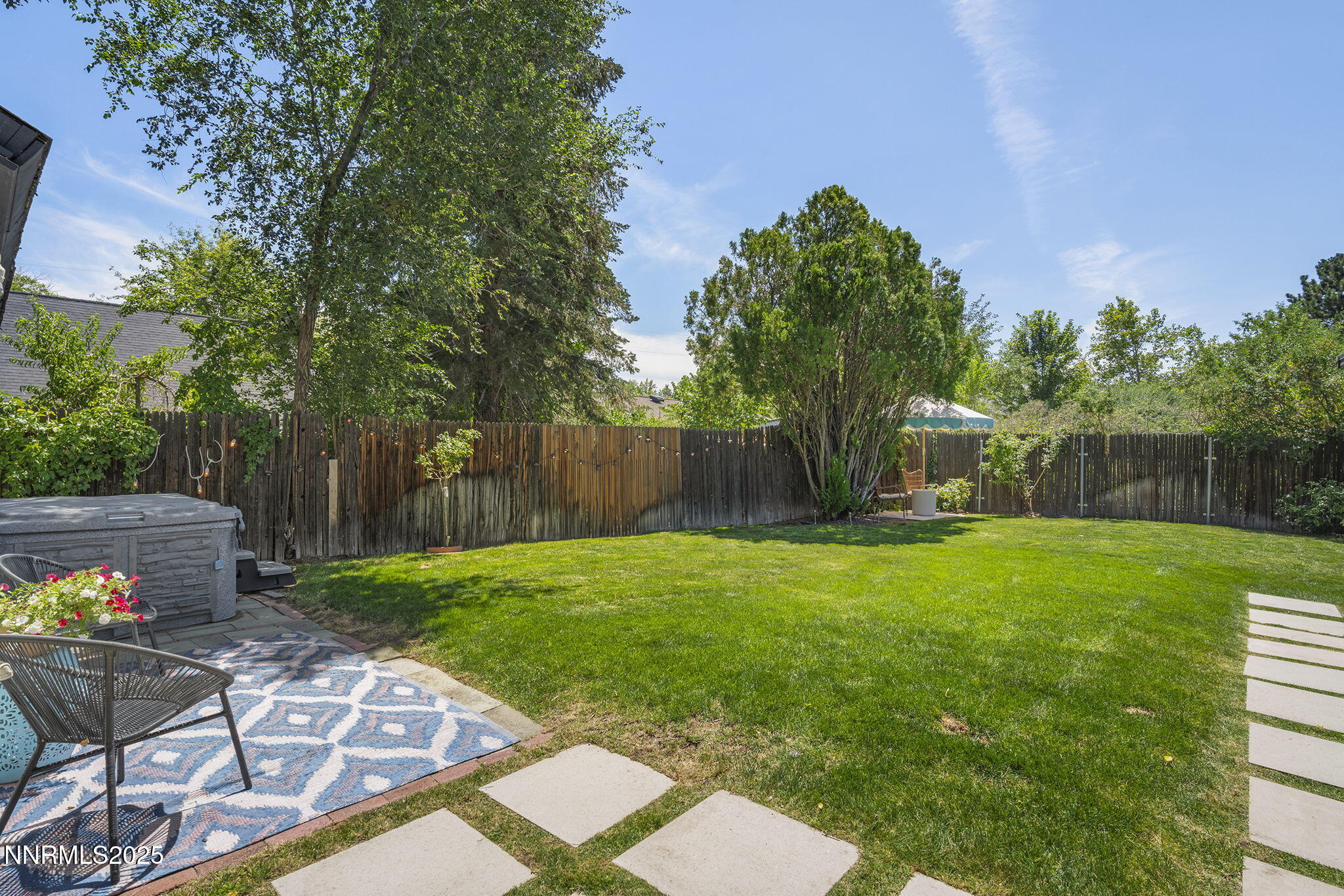 2330 Sunrise Drive Reno, NV 89509 - Photo 46 of 48 a view of a backyard with table and chairs and a slide