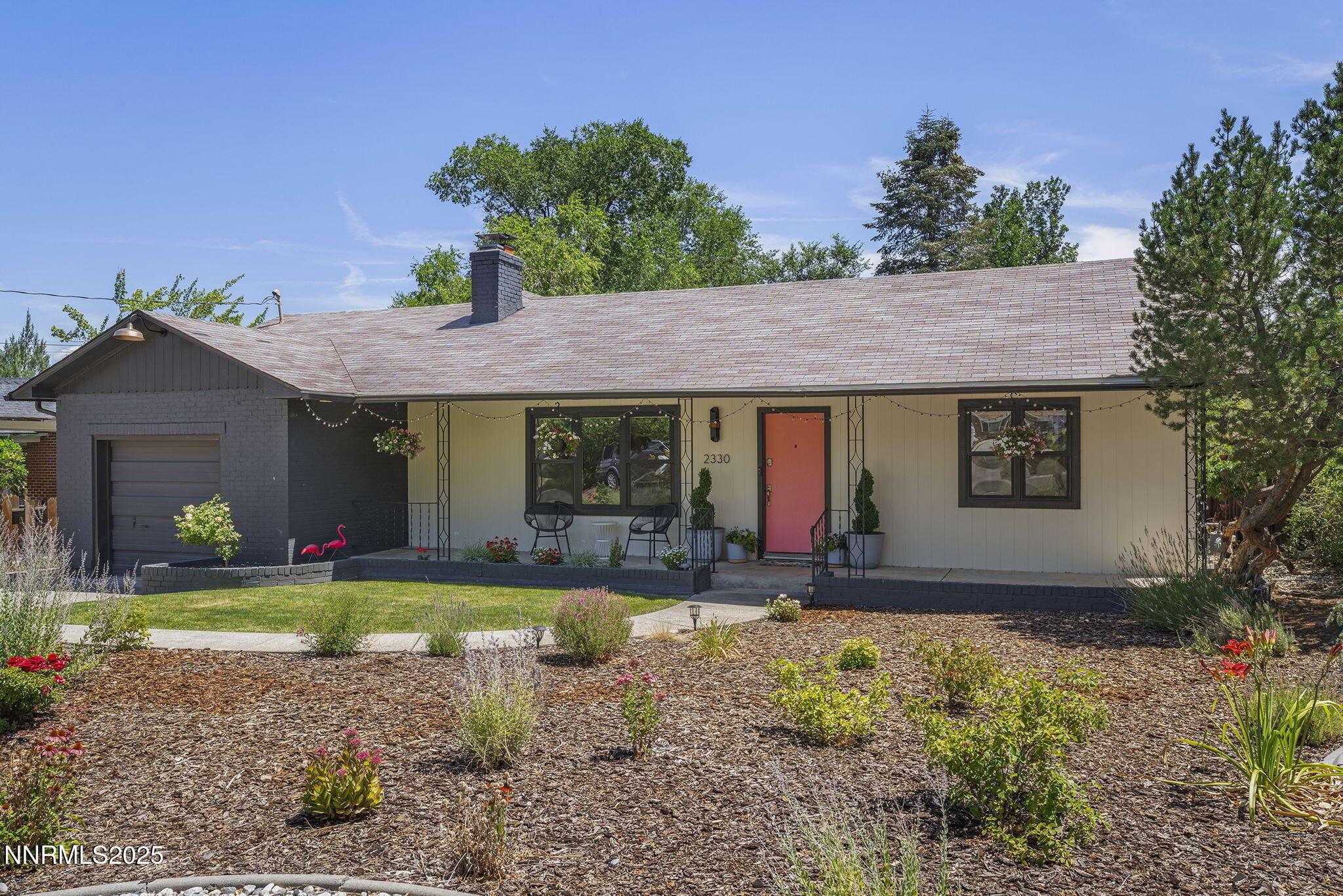 2330 Sunrise Drive Reno, NV 89509 - Photo 5 of 48 a front view of a house with a yard outdoor seating and garage