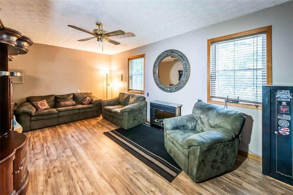 261 Clayton Trail Canton, GA 30114 - Photo 17 of 37 a living room with furniture and a large window
