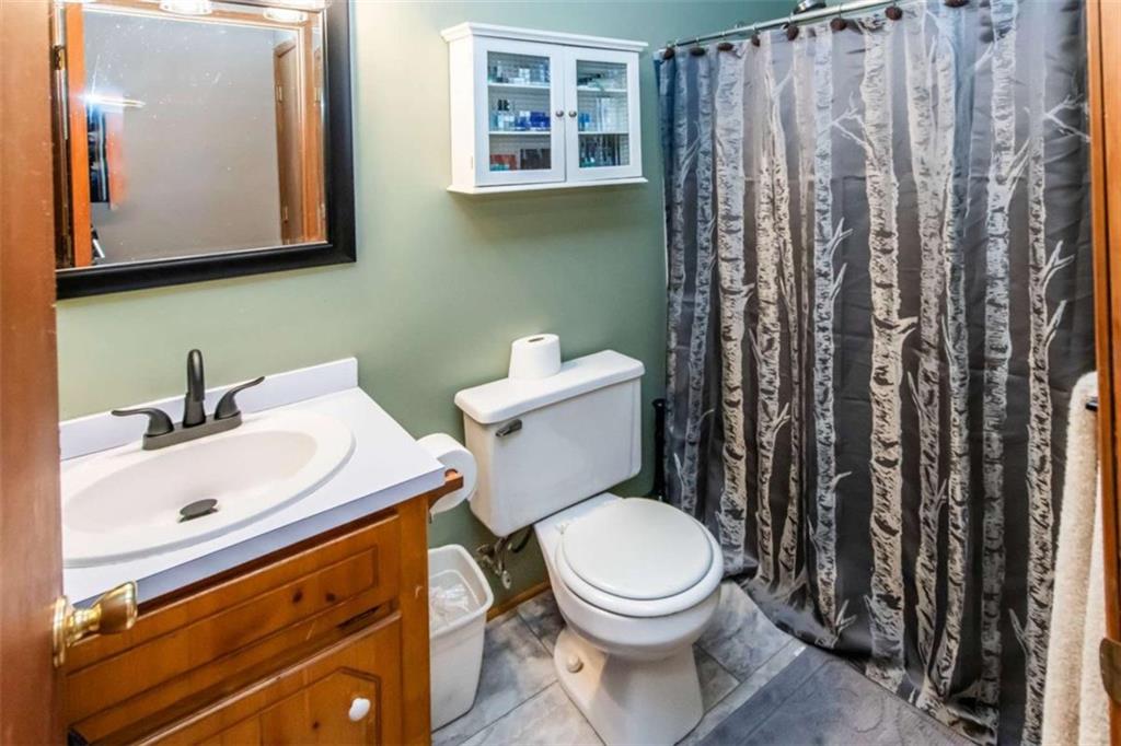 261 Clayton Trail Canton, GA 30114 - Photo 18 of 37 a white toilet sitting next to a bathroom sink