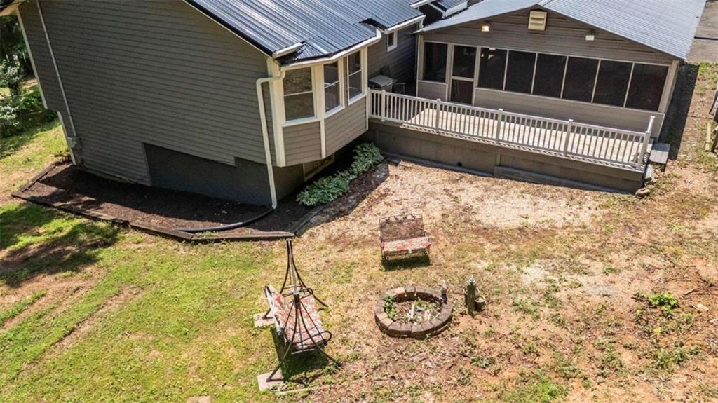 261 Clayton Trail Canton, GA 30114 - Photo 2 of 37 a view of a house with a small yard and wooden fence