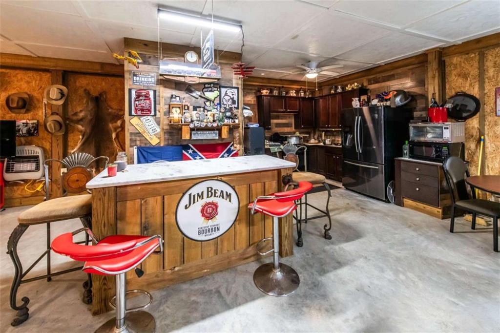 261 Clayton Trail Canton, GA 30114 - Photo 26 of 37 a view of a room with gym equipment