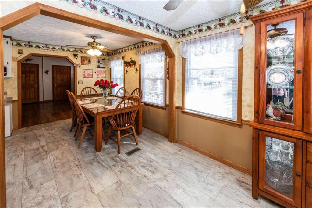 261 Clayton Trail Canton, GA 30114 - Photo 7 of 37 a view of a dining room with furniture window and wooden floor