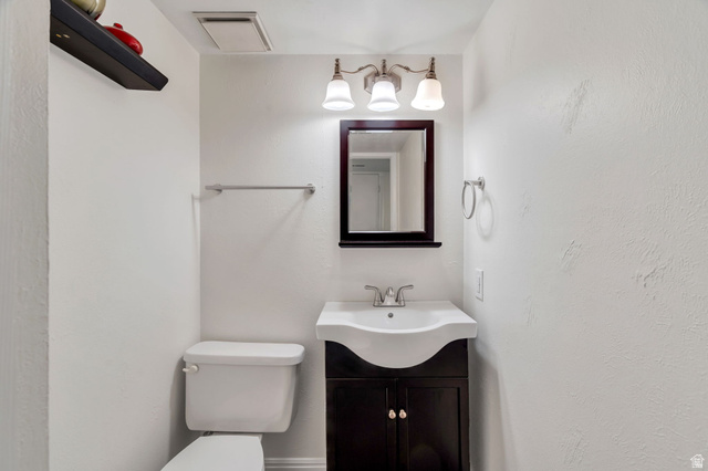 3221 North Shadowbrook Circle Provo, UT 84604 - Photo 7 of 29 Bathroom featuring vanity and toilet