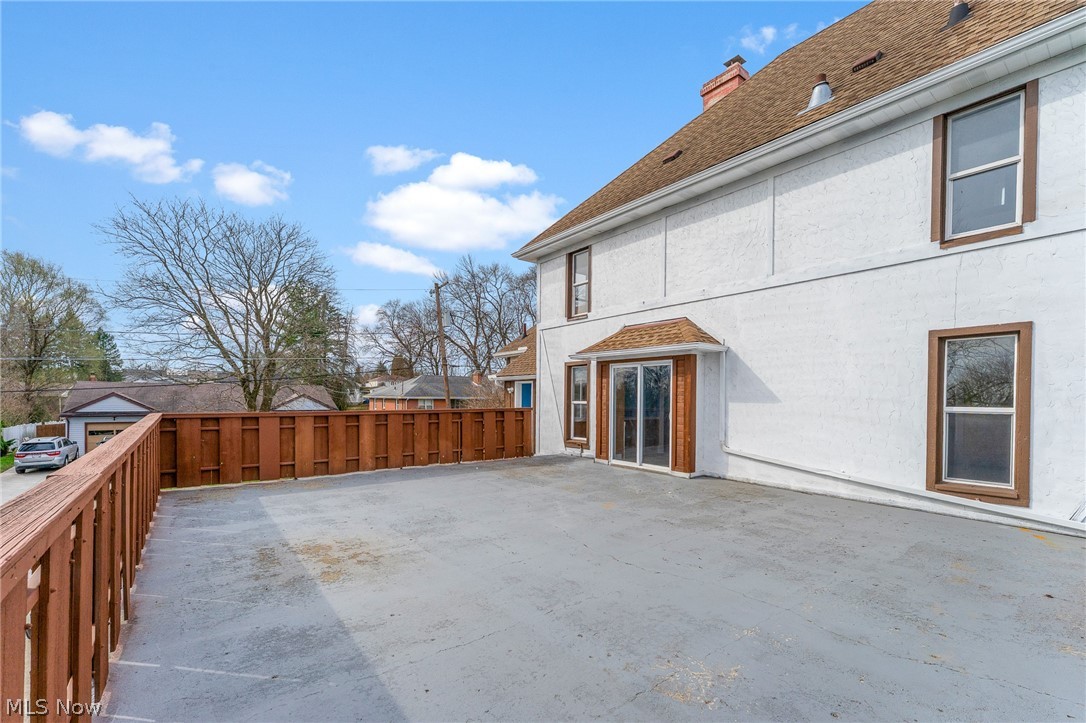 563 Geneva Avenue Struthers, OH 44471 - Photo 26 of 31 Back of house with a chimney, stucco siding, a shingled roof, and a patio area
