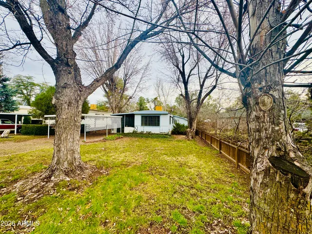 a house with swimming pool in front of it