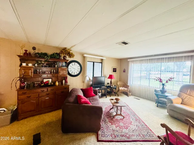 a living room filled with furniture and a table