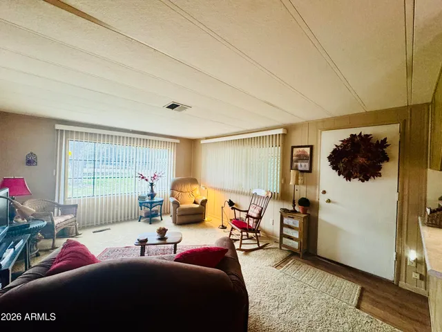 a bedroom with furniture and a window