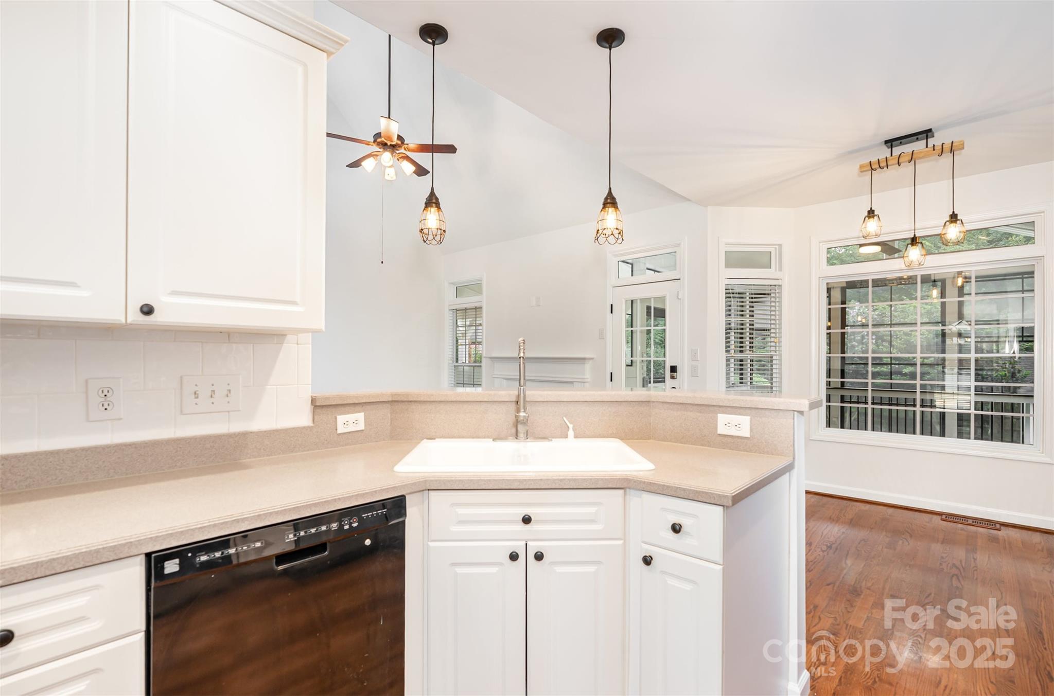 2746 Cameron Commons Way Matthews, NC 28104 - Photo 13 of 38 a kitchen with a sink stove and cabinets