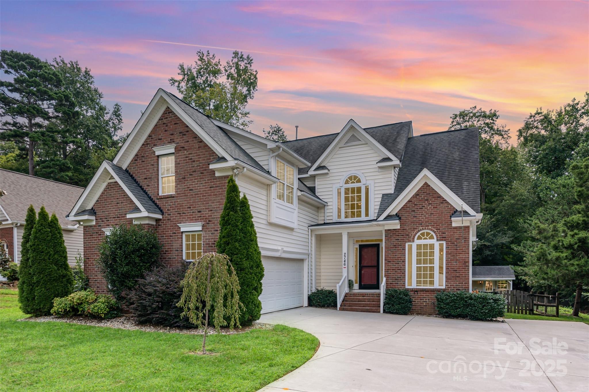 2746 Cameron Commons Way Matthews, NC 28104 - Photo 2 of 38 a front view of a house with a yard