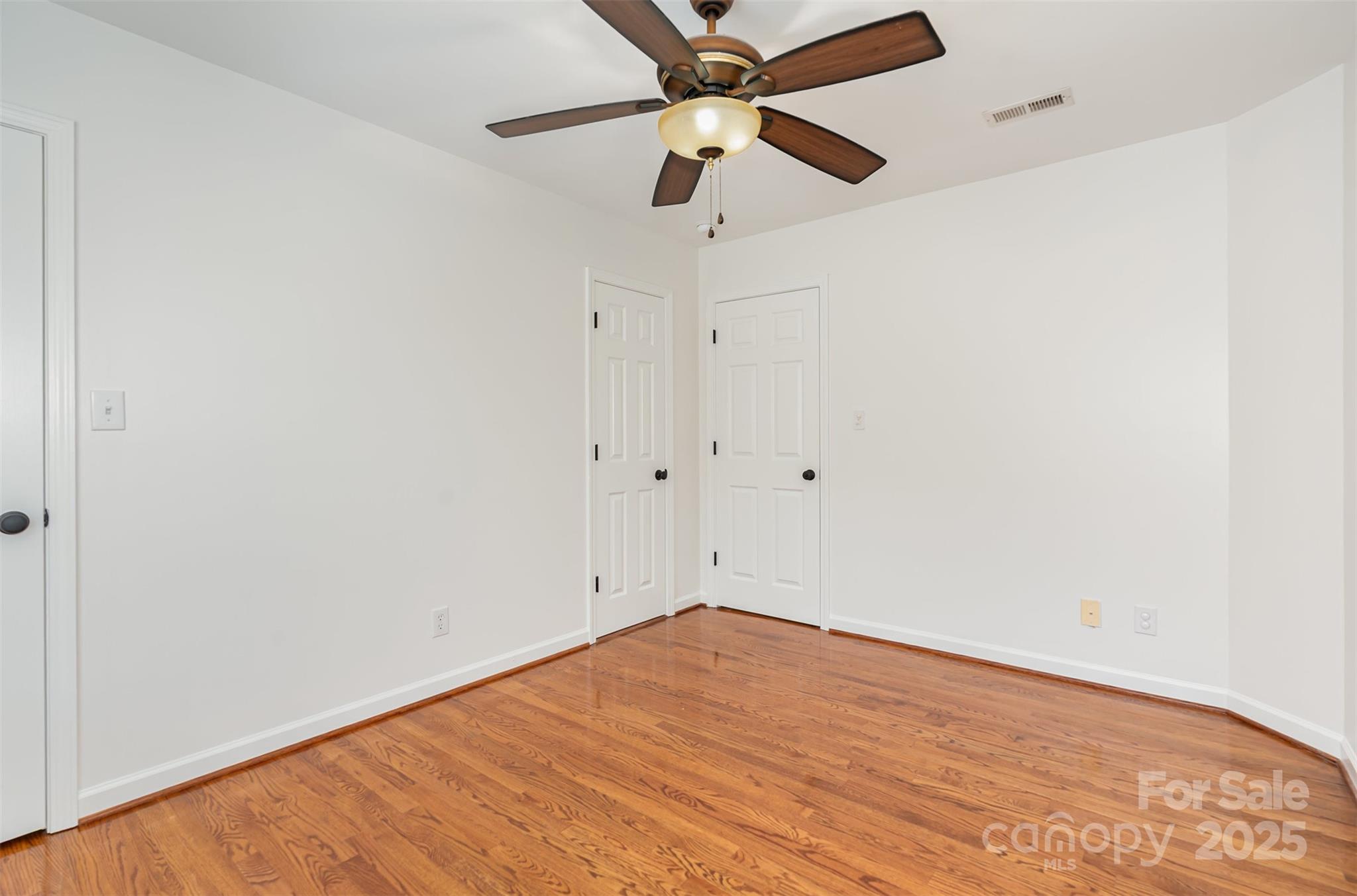2746 Cameron Commons Way Matthews, NC 28104 - Photo 25 of 38 an empty room with a window and a fan