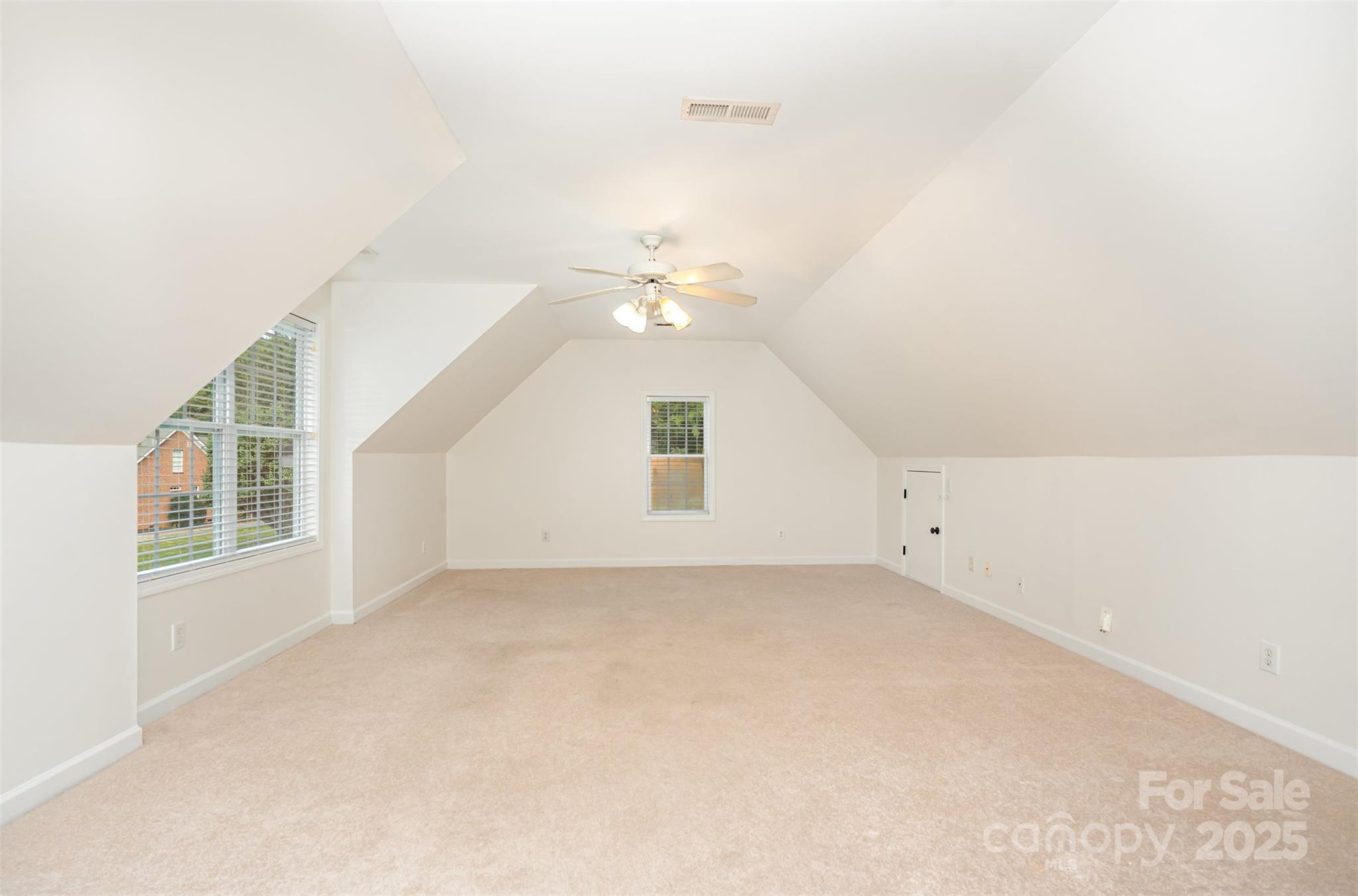 2746 Cameron Commons Way Matthews, NC 28104 - Photo 28 of 38 an empty room with windows and entrance