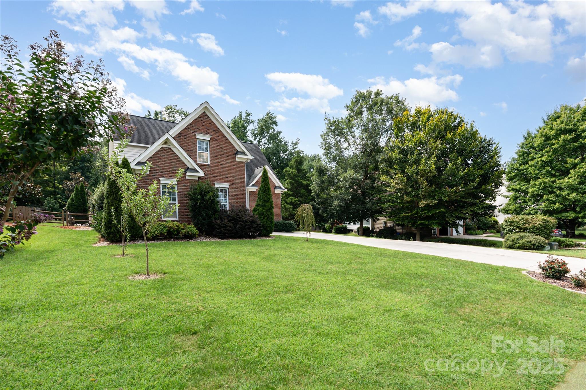 2746 Cameron Commons Way Matthews, NC 28104 - Photo 3 of 38 a view of a house with a backyard