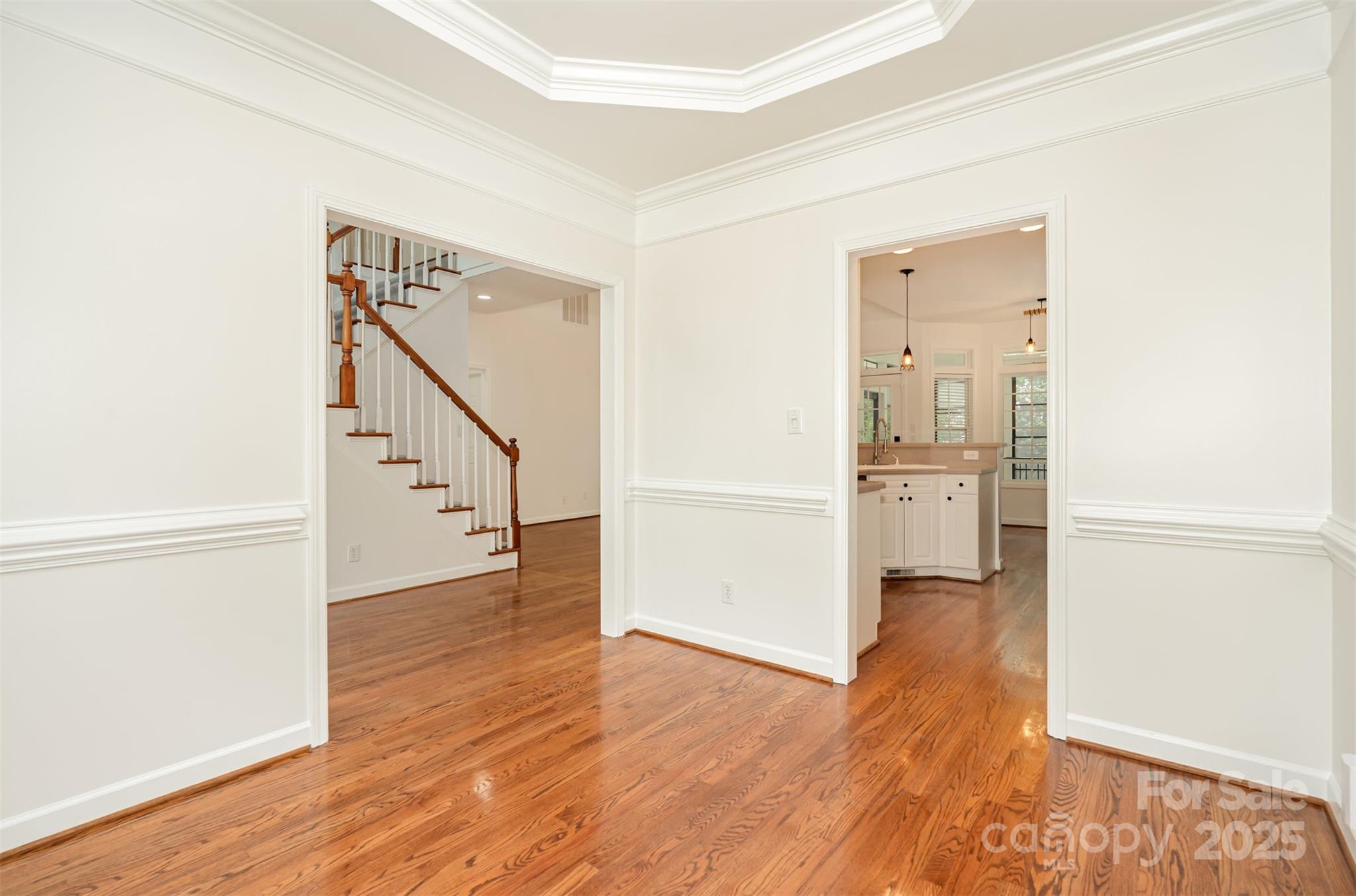 2746 Cameron Commons Way Matthews, NC 28104 - Photo 10 of 38 a view of a hallway with wooden floor and entryway