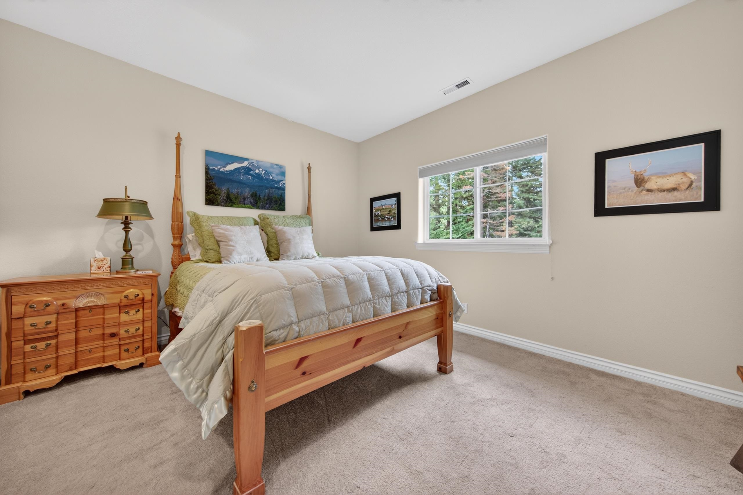 1017 Timber Ridge Road Lake Almanor, CA 96137 - Photo 24 of 45 a bedroom with a bed and a dresser