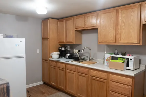 a kitchen with stainless steel appliances granite countertop a refrigerator sink and cabinets