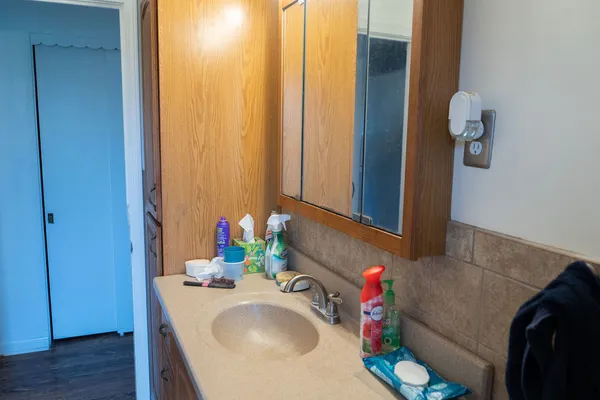 a bathroom with a sink and a mirror