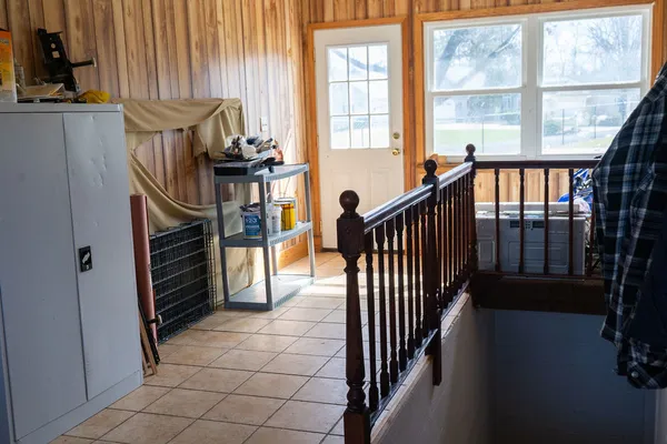 a view of entryway and hall with wooden floor